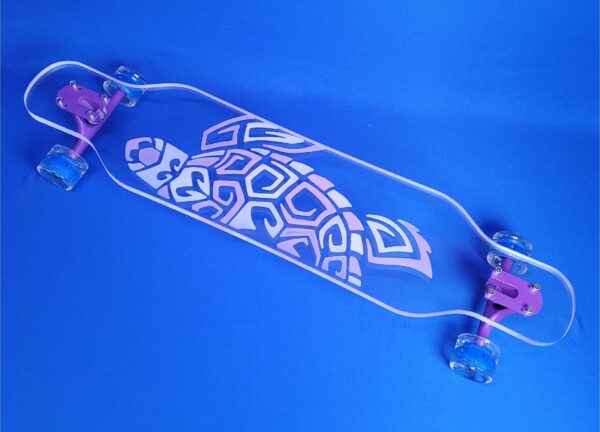 color changing turtle board. uv resin can make the design look white and pink. once the longboard is in the sun the colors change to blue and purple.
