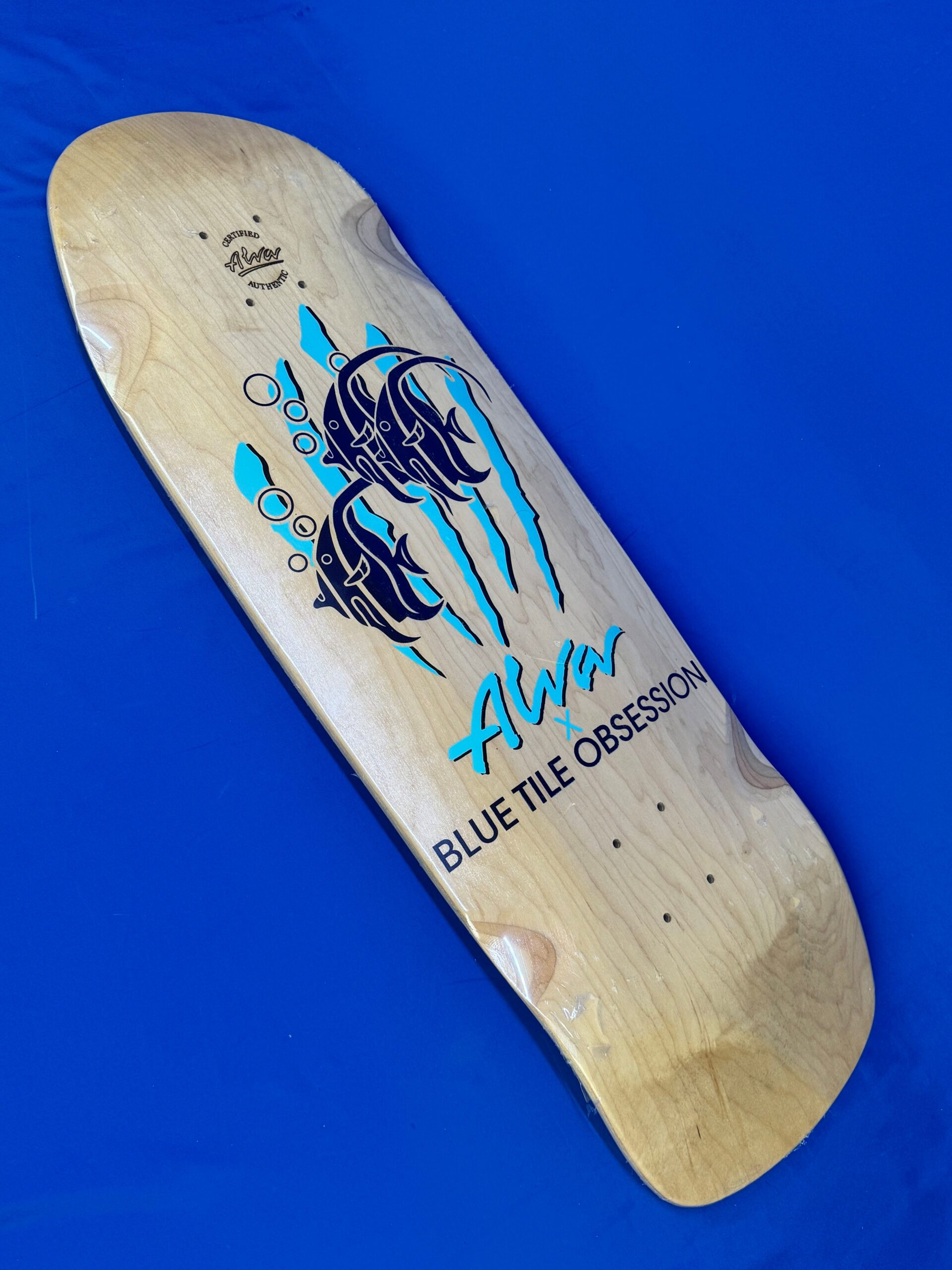 The ALVA x Blue Tile Obsession Limited Edition Deck (32" × 10.25", 16" WB) features hand silk-screened artwork, modern concave, and large wheel wells. Wide, stable, and built for bowls, pools, or stylish cruising.